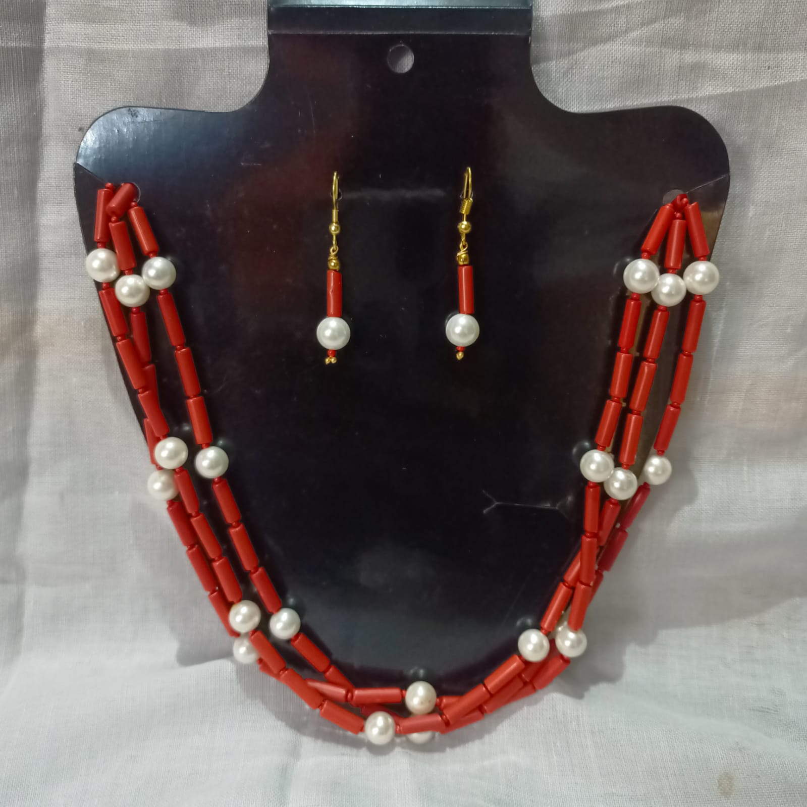 Buy CORAL PIPE AND PEARL NECKLESS